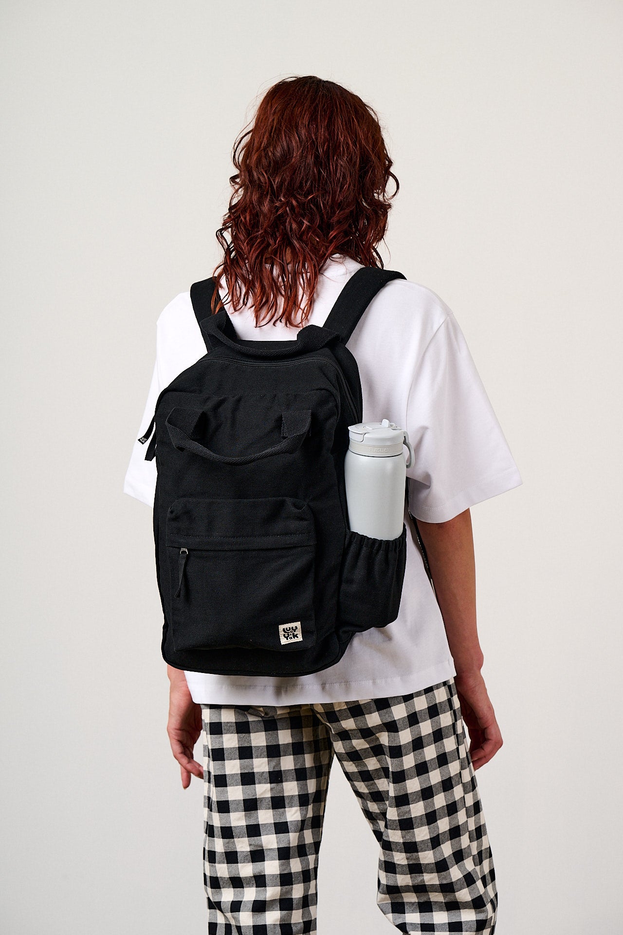 Colby - Backpack in Black with Green Lining