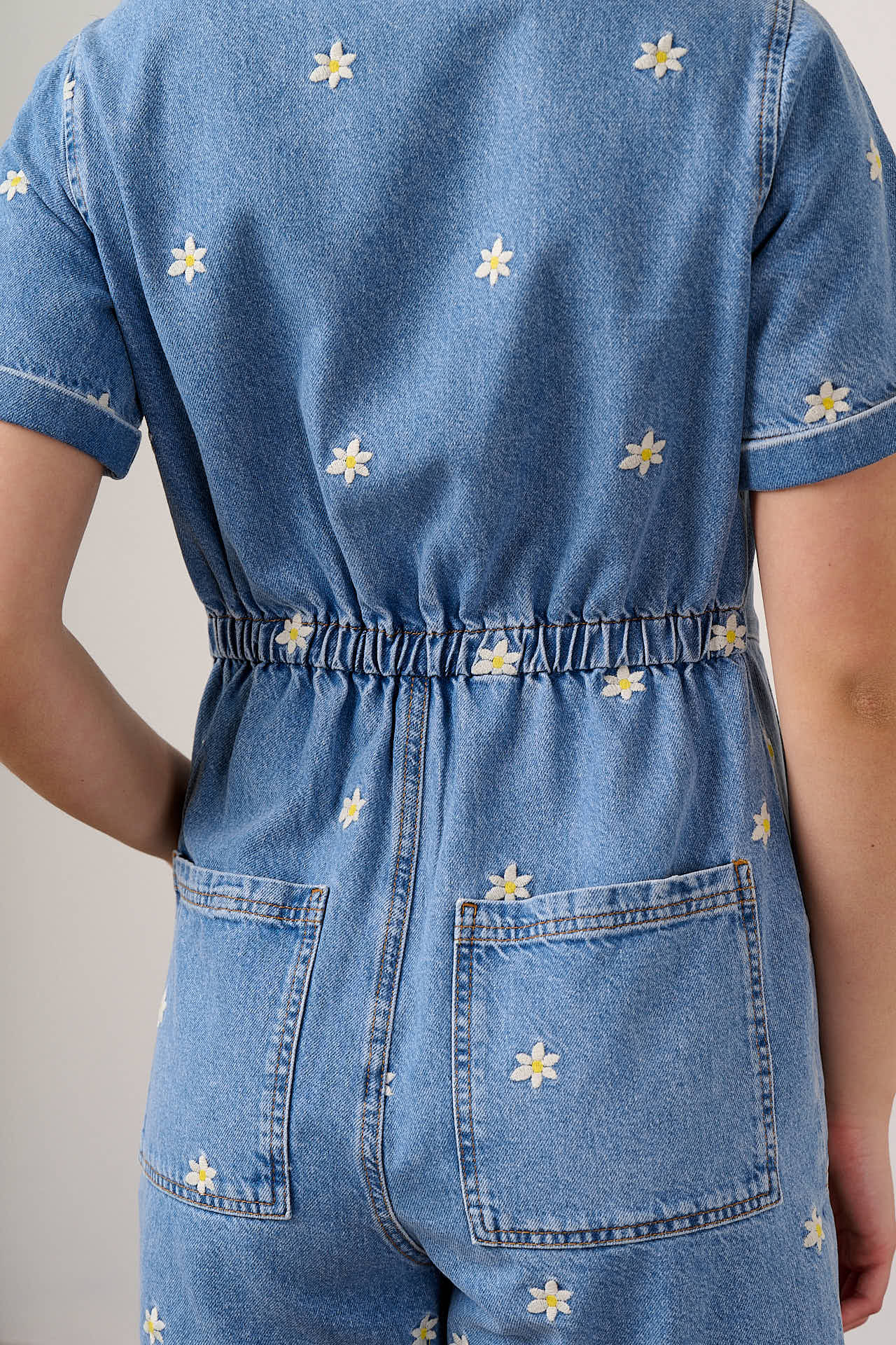 Riley - Denim Playsuit in Light Wash with Daisy Embroidery